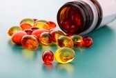 8721097-red-and-yellow-capsules-of-vitamins-on-a-blue-background